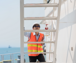 seamen going up ladder on ship
